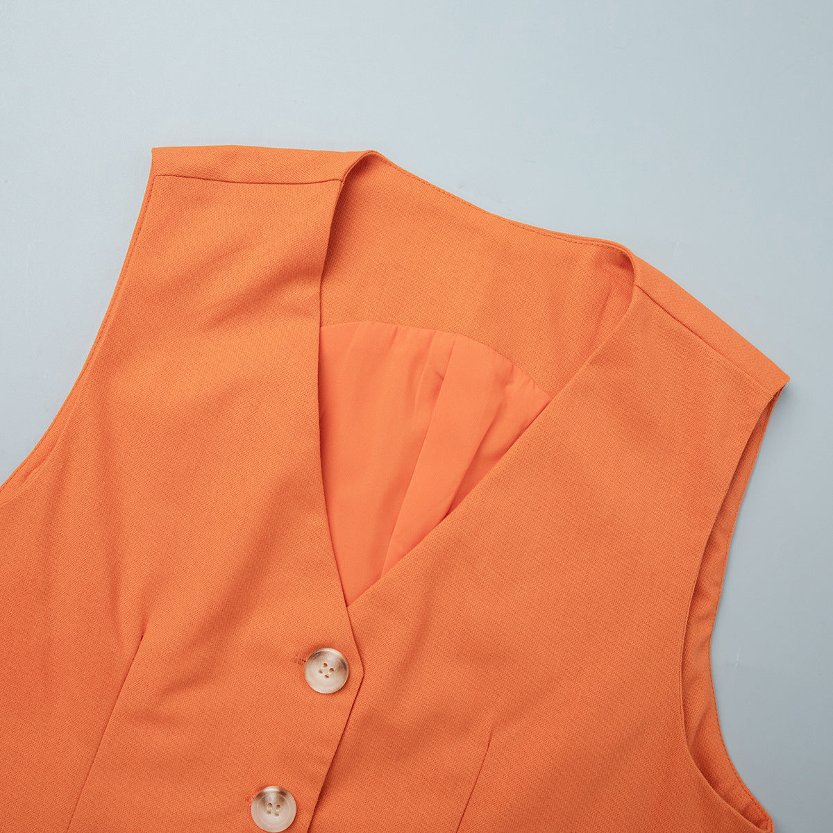 Linen Vest & Maxi Skirt Set in Orange — close-up of V-neck and buttons