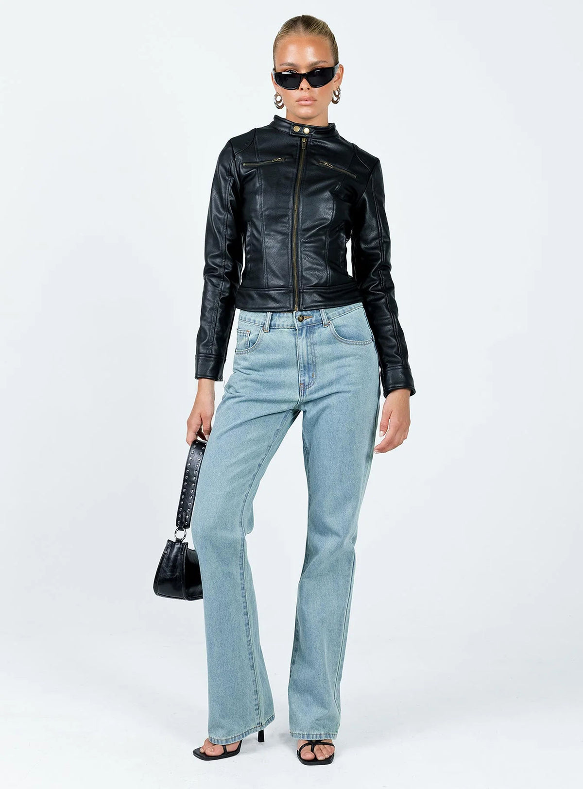 Fitted Faux Leather Moto Jacket with Stand Collar in Black — full-length view on model with jeans