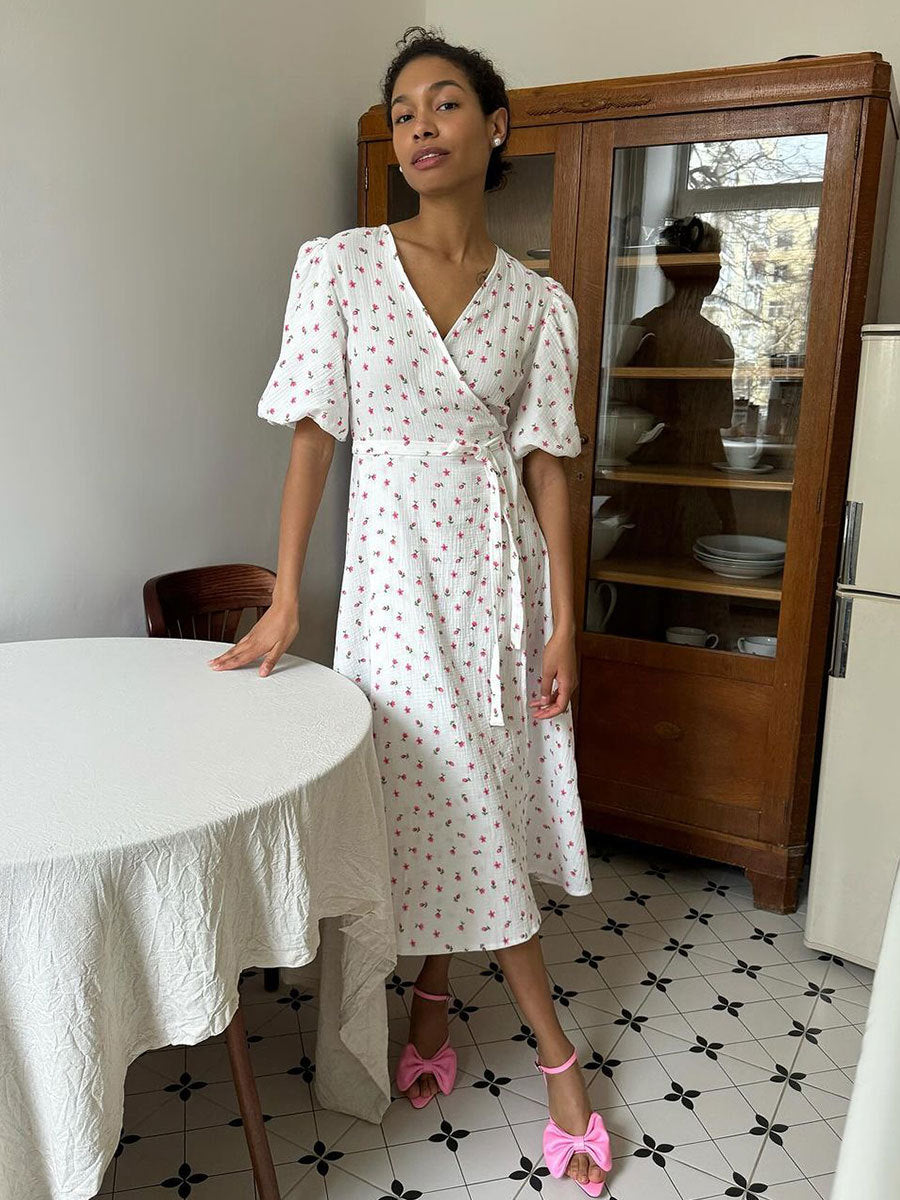 Cotton Floral Puff-Sleeve Wrap Midi Dress in Yellow Floral — indoor front on model