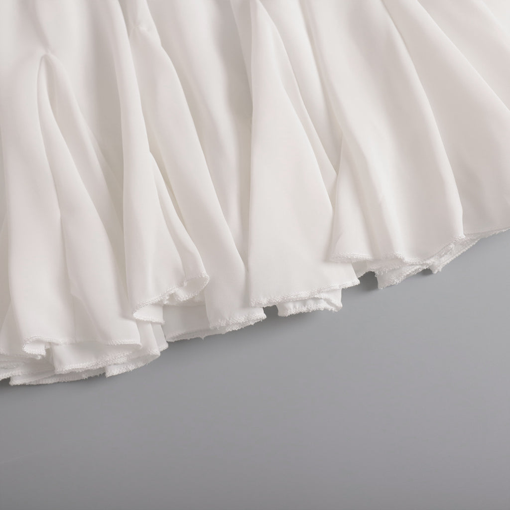 Pleated Bubble Mini Skirt in White — close-up of fabric