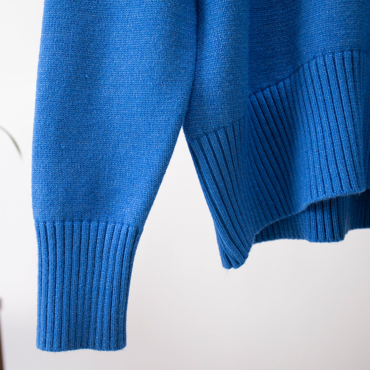 Oversized Knit Turtleneck Sweater in Cobalt Blue — close-up of wide ribbed cuff and hem