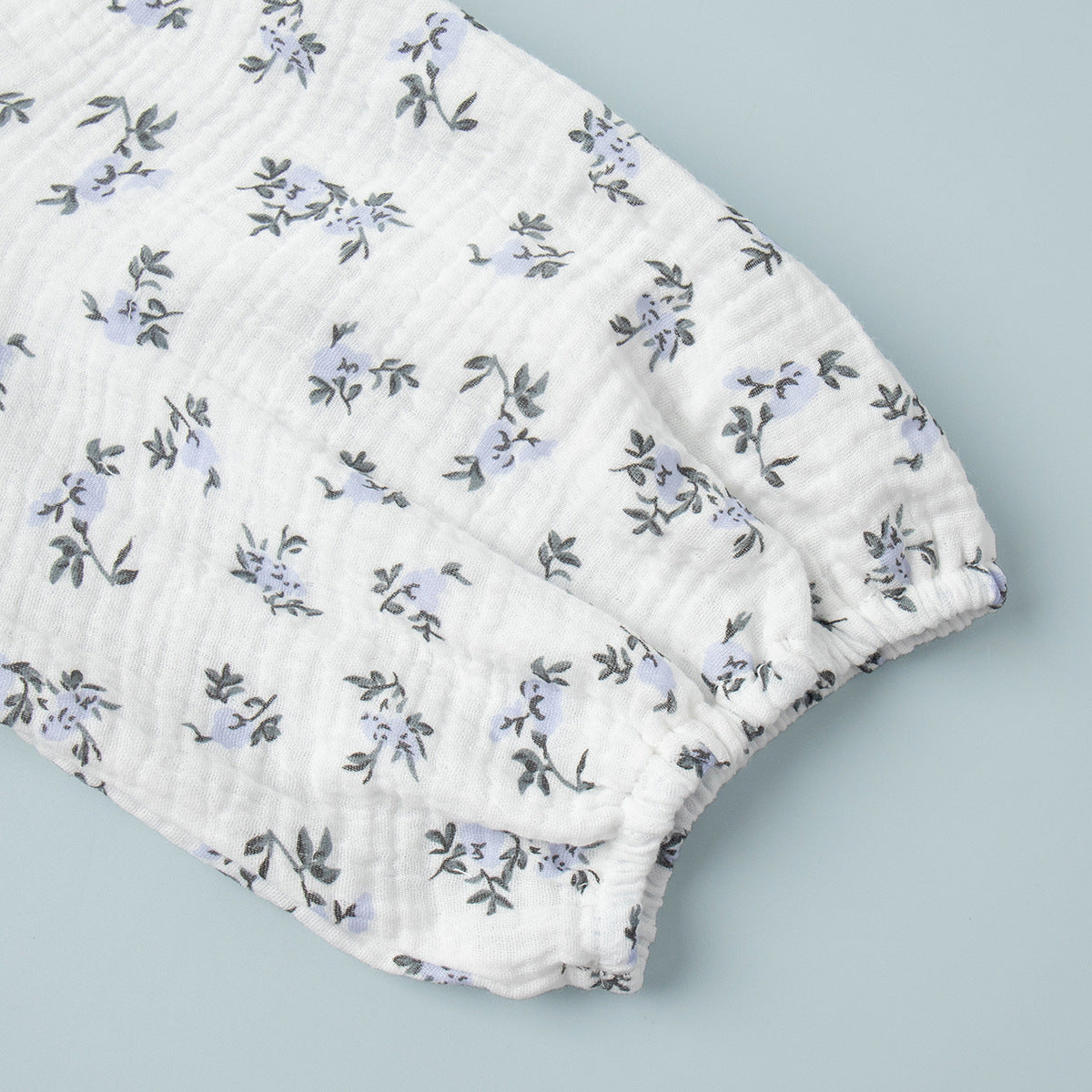 Cotton Puff-Sleeve Wrap Midi Dress in Blue Floral — close-up of the puff sleeve
