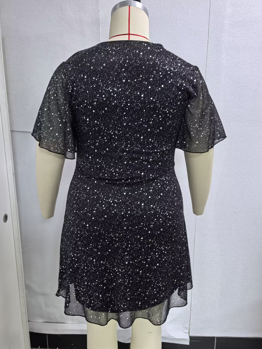 Plus-Size Glitter Wrap-Front Party Dress with Flutter Sleeves in Black — back view on mannequin
