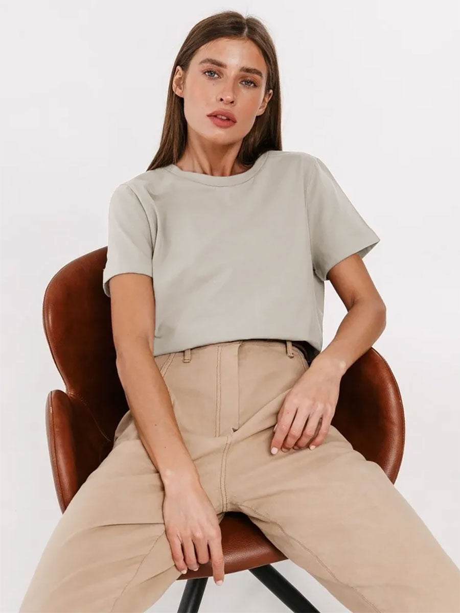 Everyday Cotton Short Sleeve Crew Tee in Oatmeal — seated on model