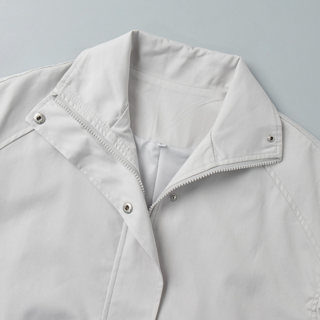 Cotton Drawstring Waist Jacket with Stand Collar in Off-White — close-up of stand collar and snap placket
