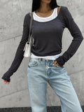 Layered-Look Scoop Neck Long-Sleeve Top in Charcoal — front view on model with jeans