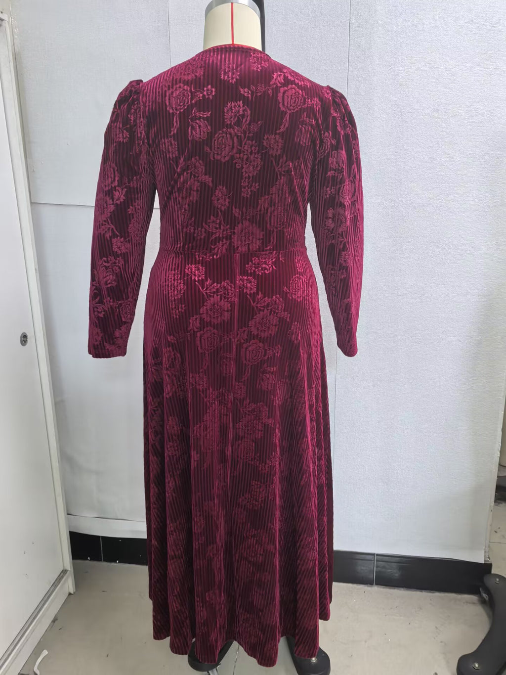 Plus-Size Floral Velvet Maxi Dress with Twist Waist in Wine — back view on mannequin