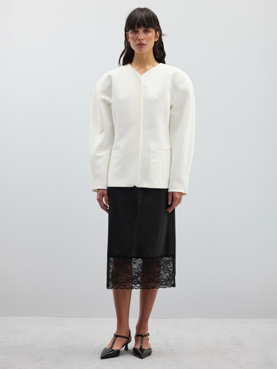 Satin Midi Skirt with Lace Hem in Black — front view on model with blazer