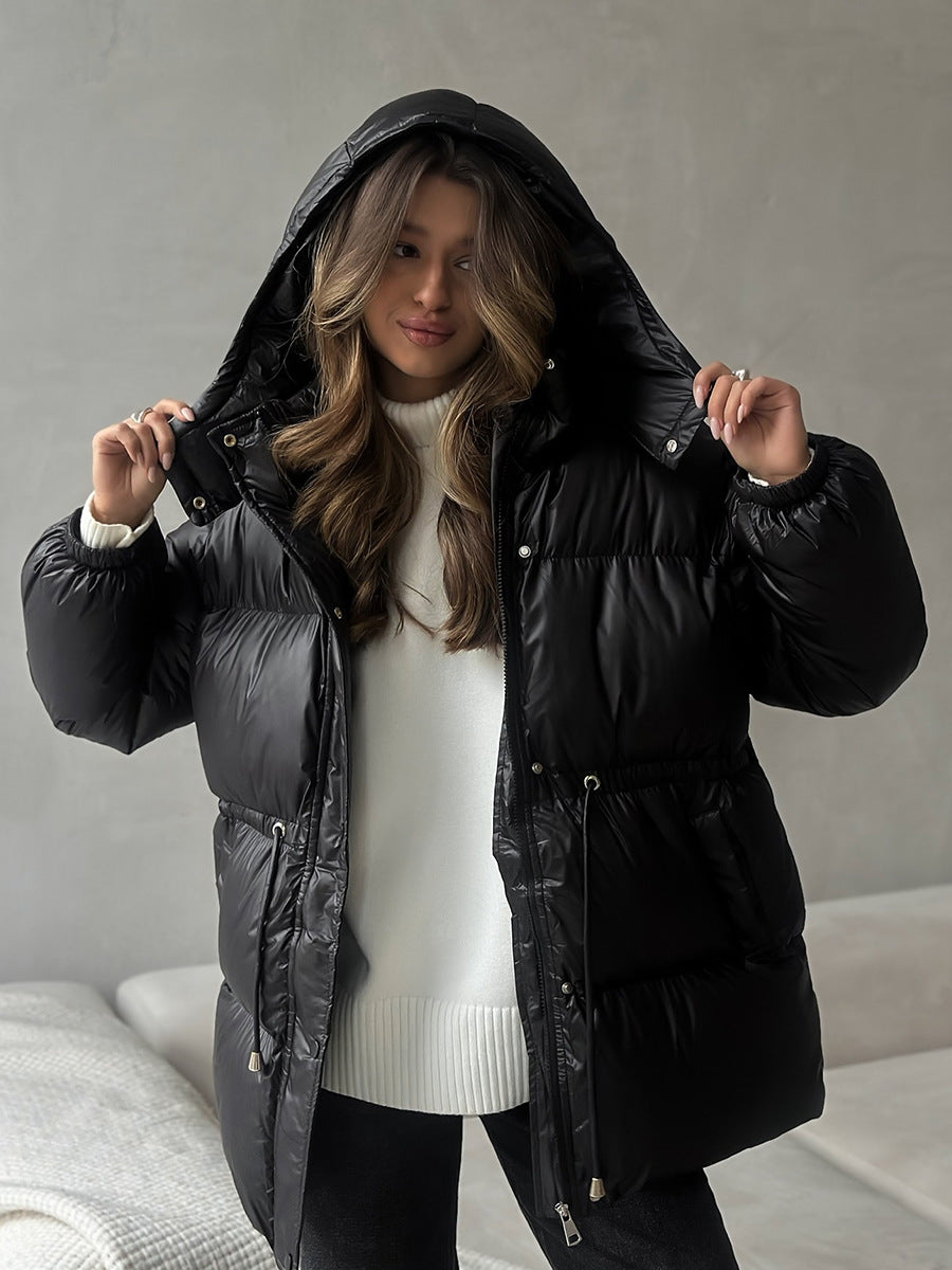 Hooded Puffer Jacket with Drawstring Waist in Black — hood up on model