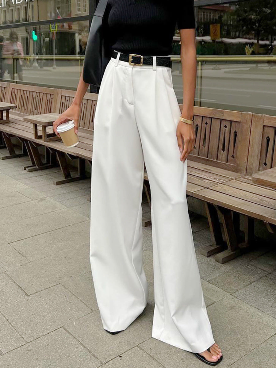 High-Waist Pleated Wide-Leg Trousers in White — on model