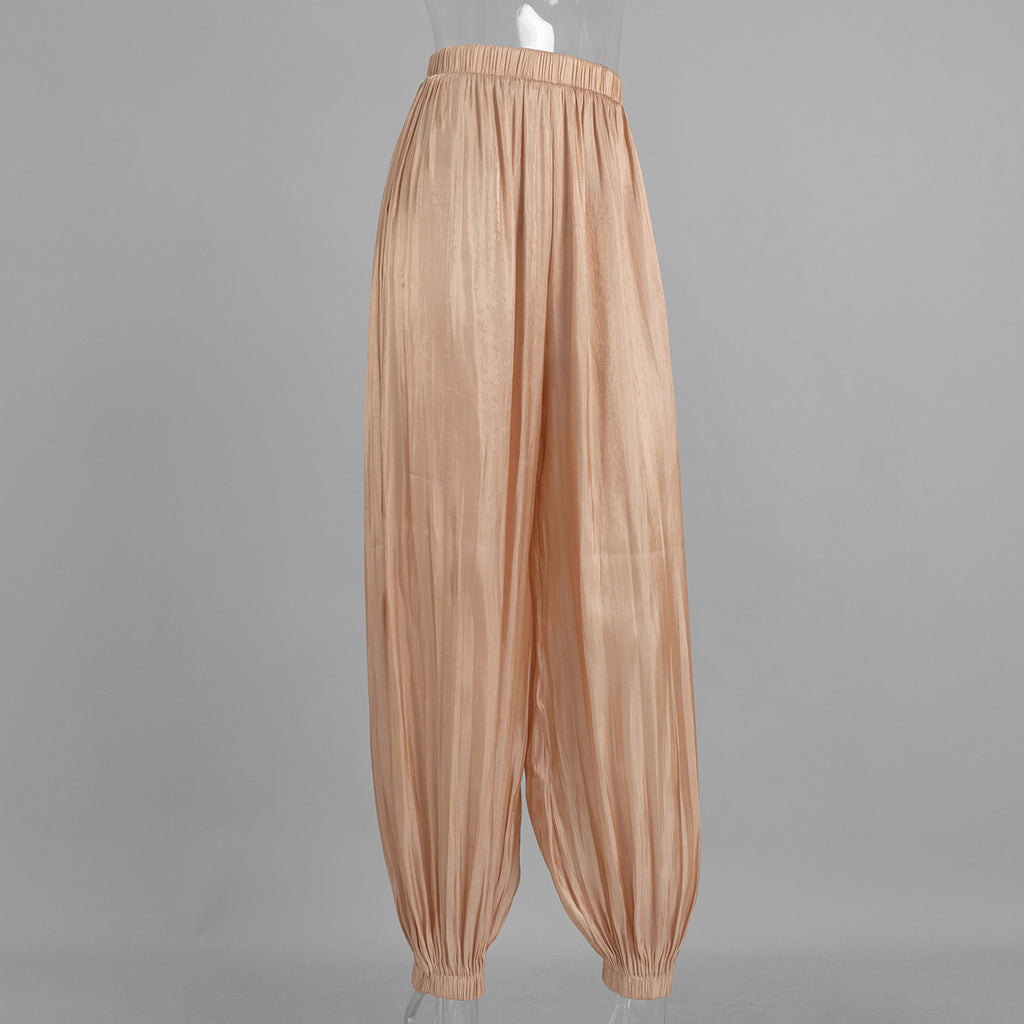 Shiny Pleated Harem Pants with Elastic Cuffs in Champagne — front view on mannequin