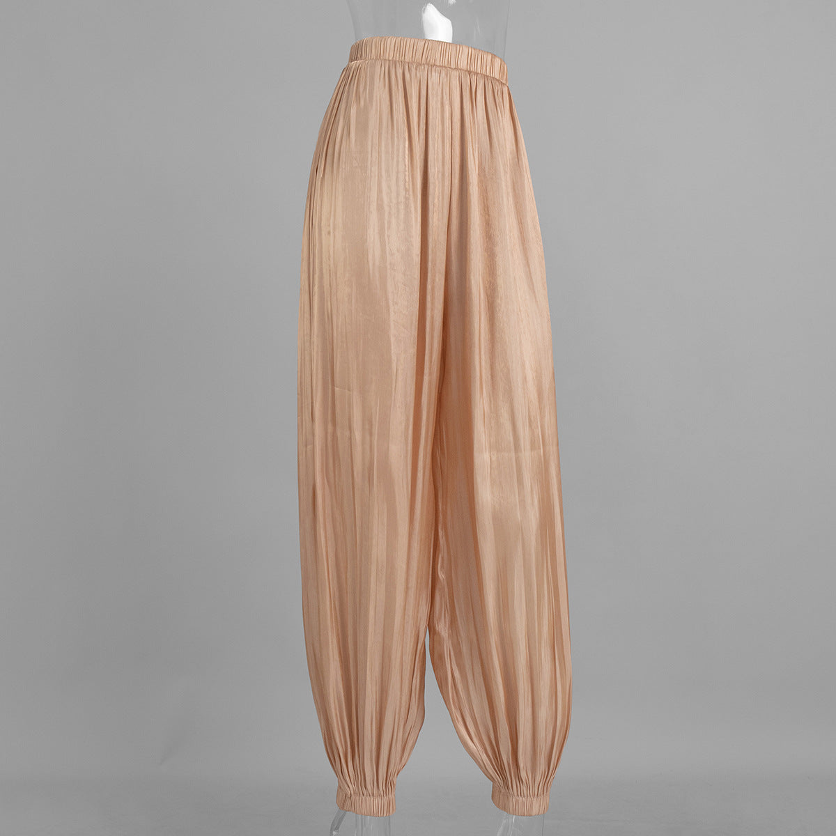 Shiny Pleated Harem Pants with Elastic Cuffs in Champagne — front view on mannequin