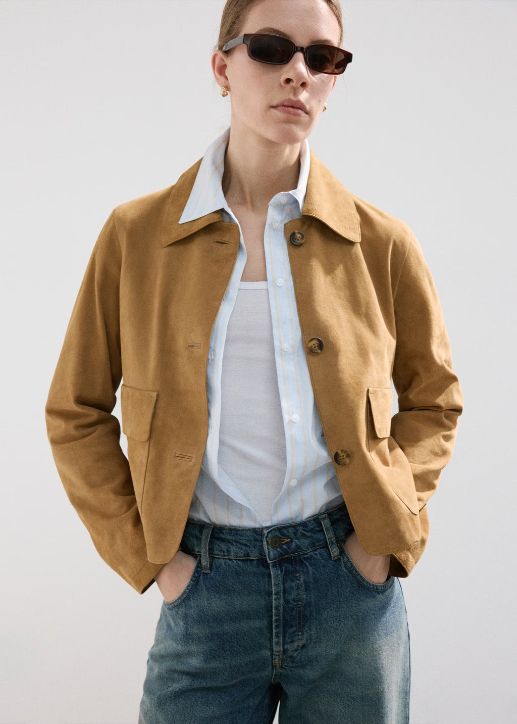 Cropped Faux Suede Jacket with Patch Pockets in Camel — front view on model