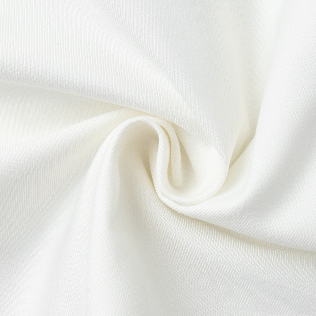 V-Neck Vest & Pleated Shorts Set in White — close-up of the fabric