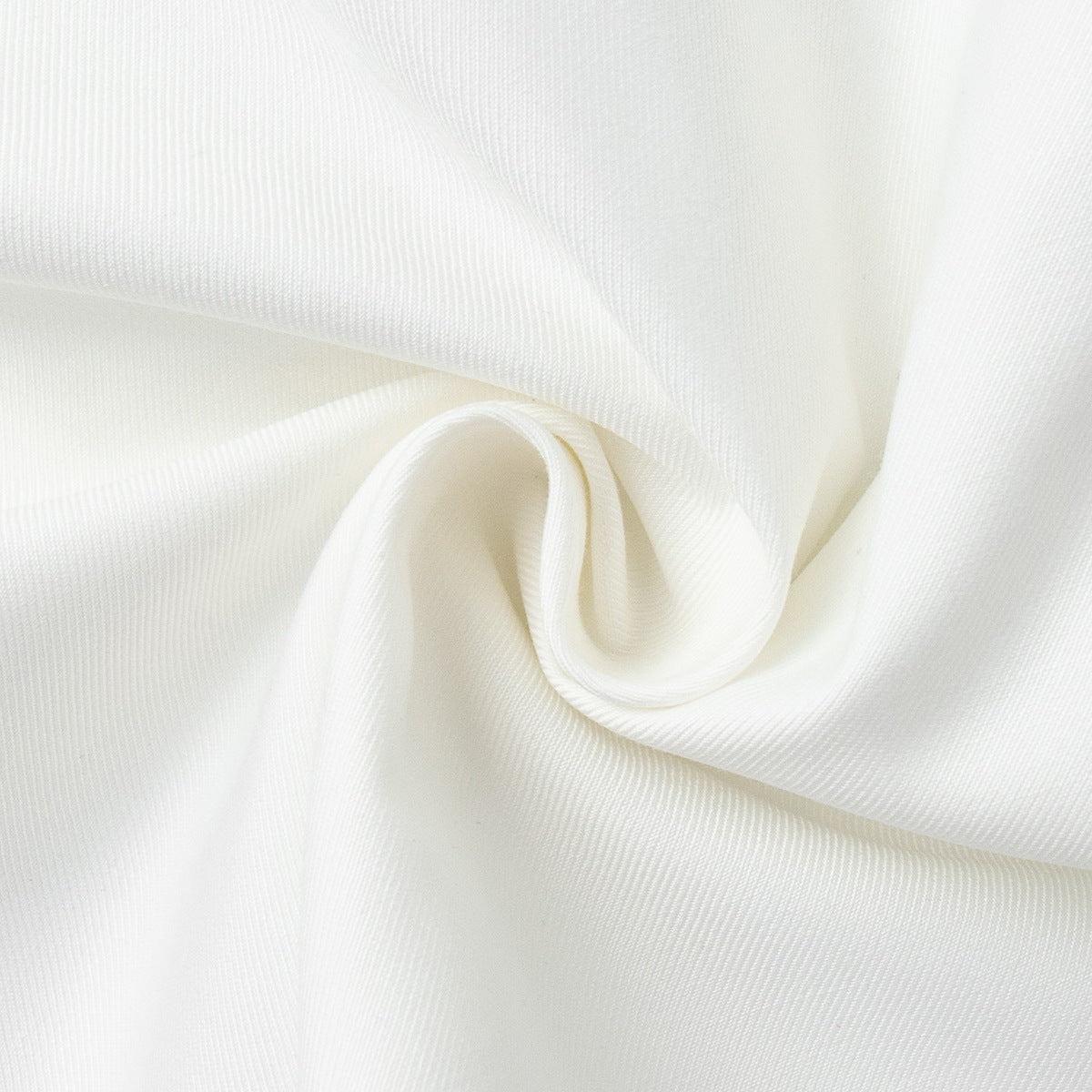 V-Neck Vest & Pleated Shorts Set in White — close-up of the fabric