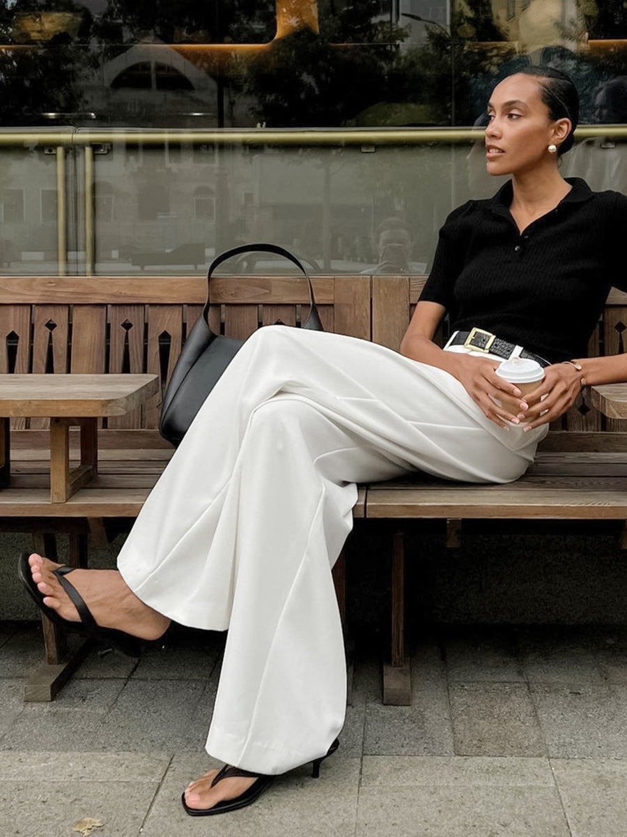 High-Waist Pleated Wide-Leg Trousers in White — on model