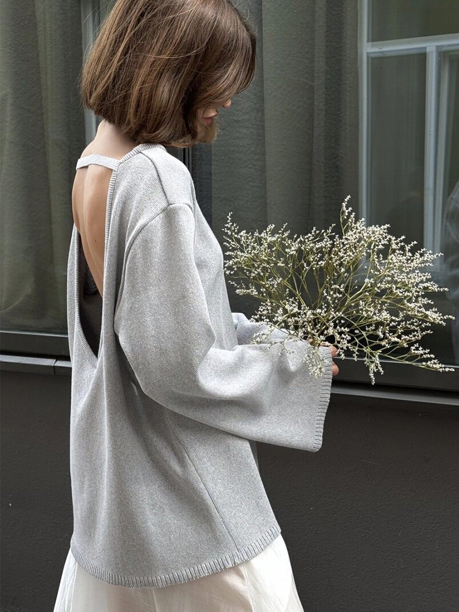Oversized Open-Back Cotton Knit Sweater in Light Gray — open back view on model