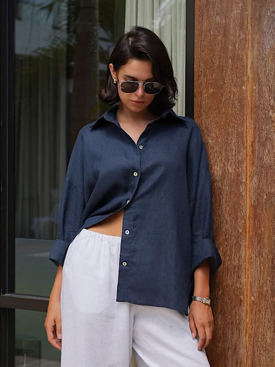 Relaxed Cotton Button-Down Shirt in Navy — on model with white pants