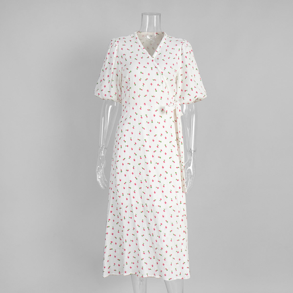 Cotton Floral Puff-Sleeve Wrap Midi Dress in Pink Floral — front on mannequin