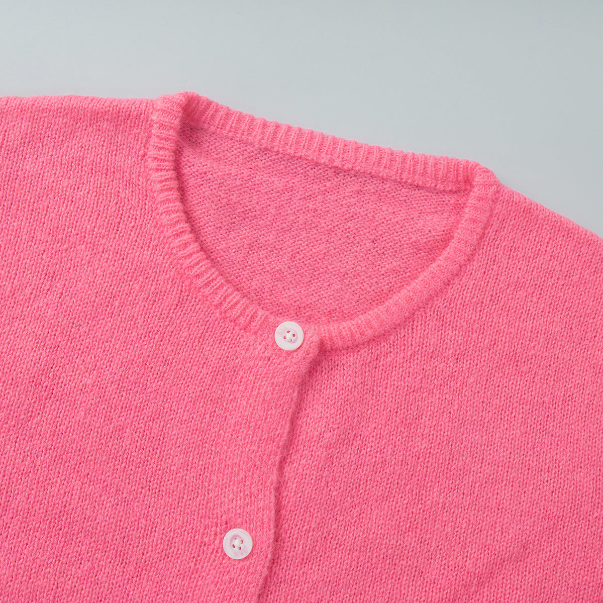 Soft Fuzzy Crew Neck Button Cardigan in Hot Pink — close-up of the crew neck and buttons