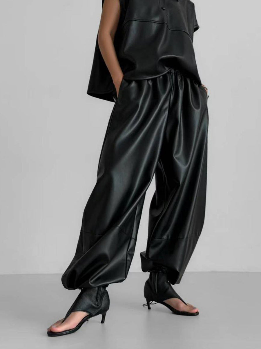 Faux Leather Balloon Pants with Drawstring Ankles in Black — on model with sandals