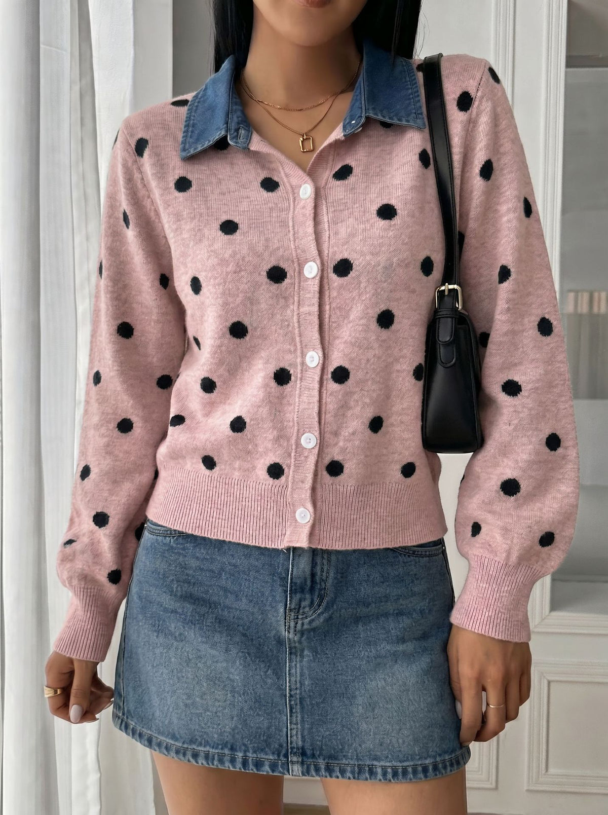 Polka-Dot Cardigan with Denim Collar in Pink — front view on model with a mini skirt