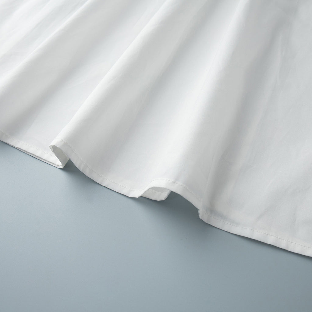 Cotton Crop Camisole & Gathered Maxi Skirt Set in White — close-up of the skirt hem