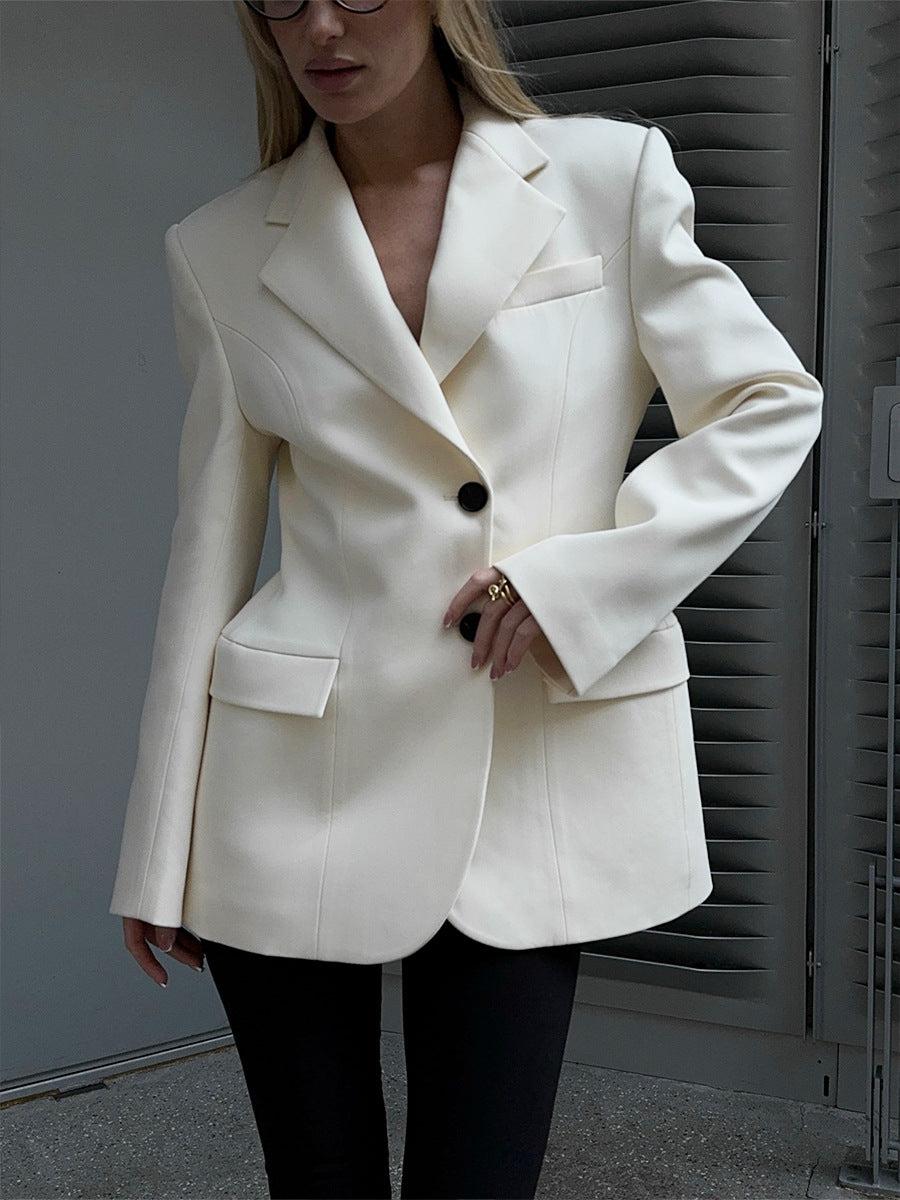 Tailored Two-Button Blazer with Cinched Waist in Ivory — side view on model
