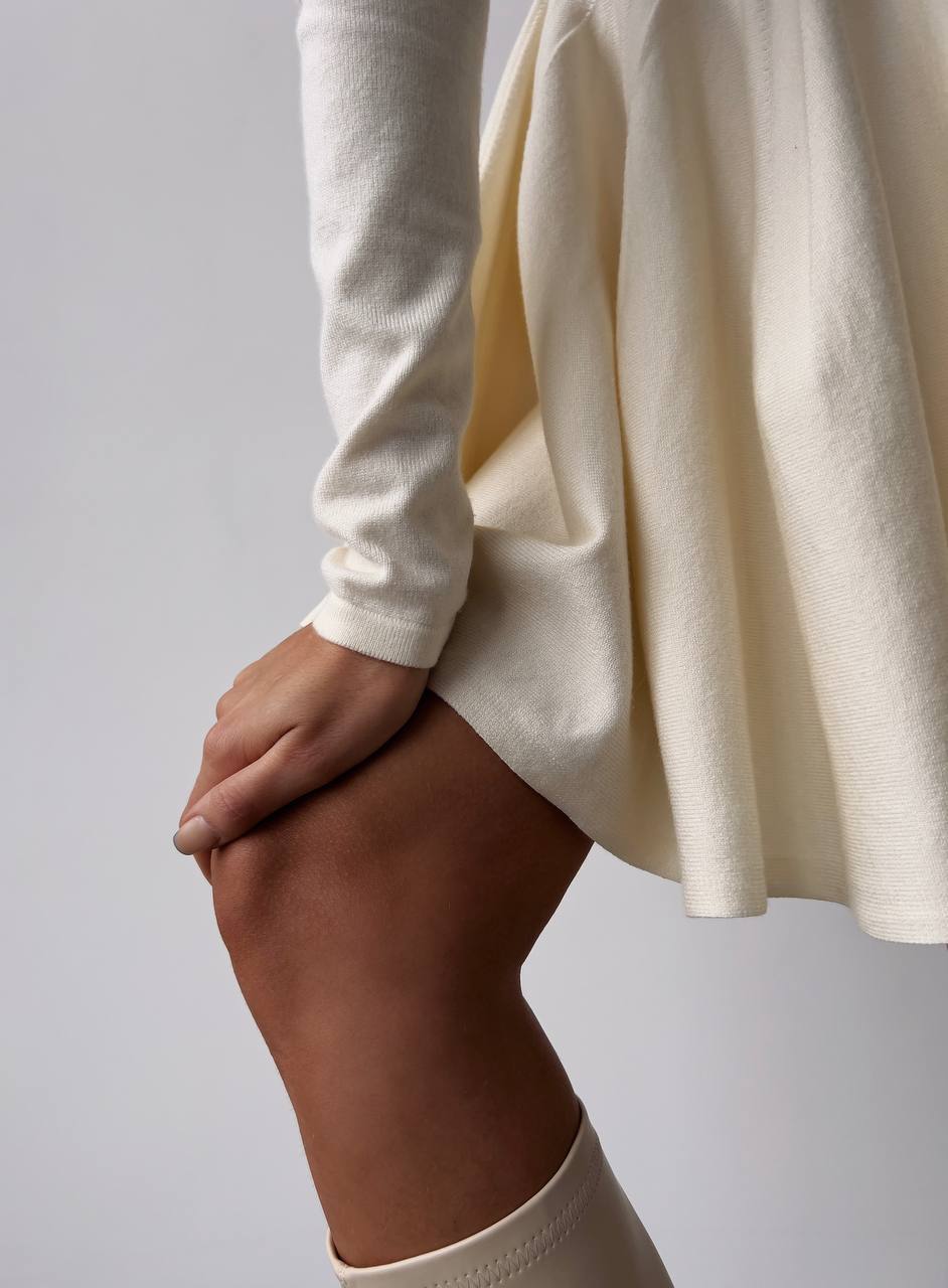 Fitted Knit Skater Mini Dress with Long Sleeves in Ivory — close view of the skirt