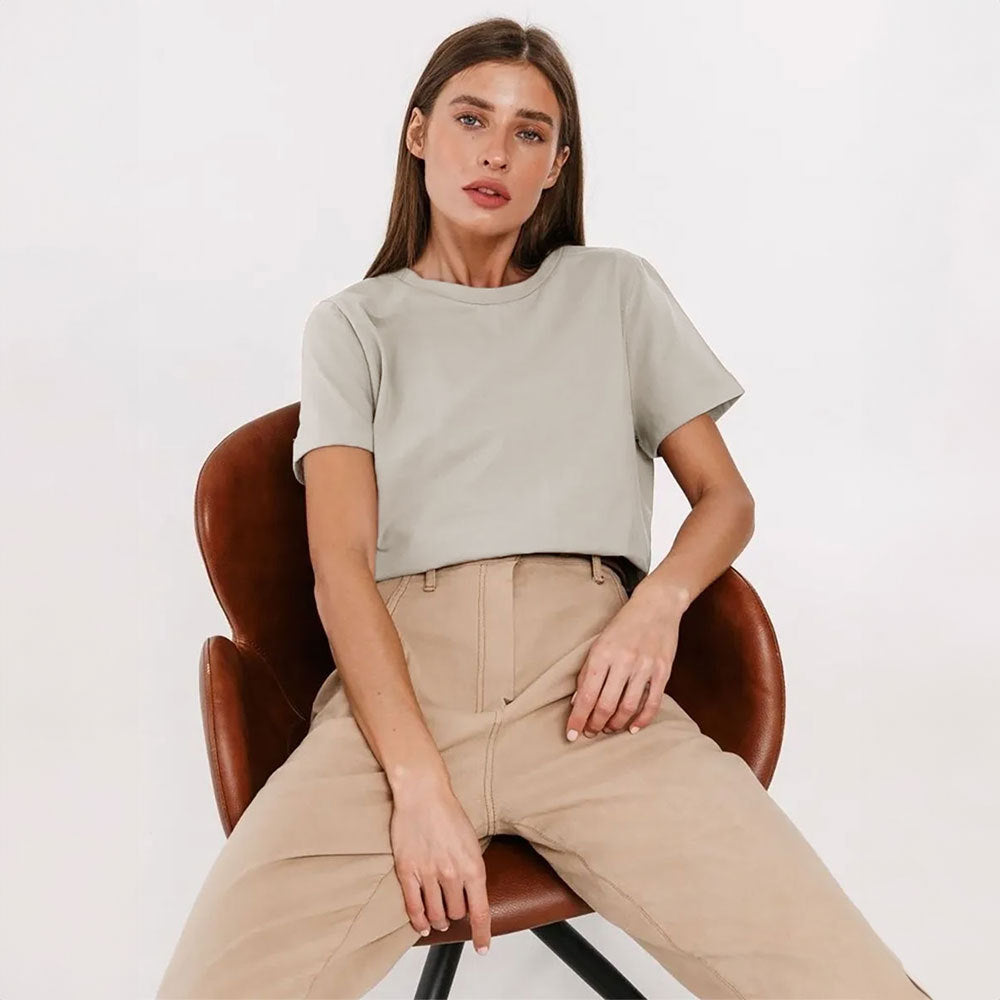 Everyday Cotton Short Sleeve Crew Tee in Oatmeal — seated on model