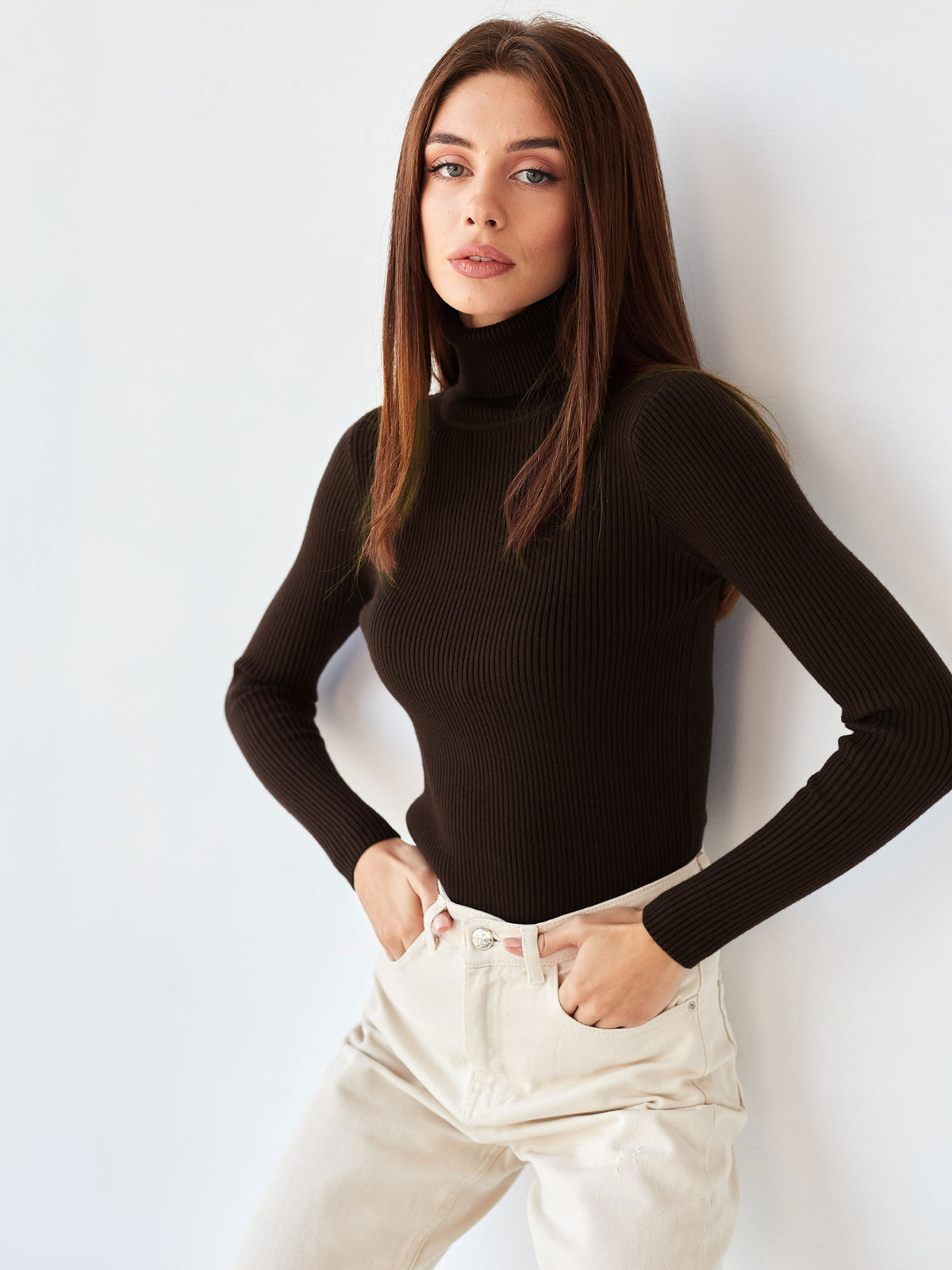 Fitted Ribbed Turtleneck Sweater in Chocolate — front view on model
