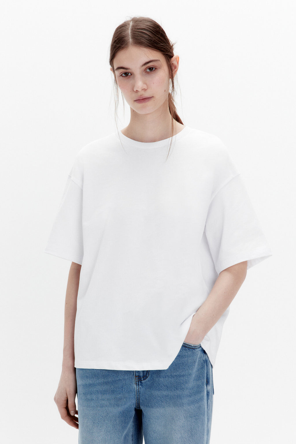 Relaxed Cotton Crew-Neck Tee in White — front view on model