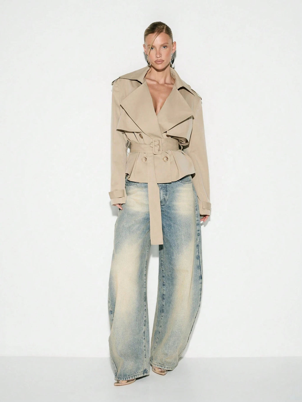 Cropped Double-Breasted Trench Jacket with Belt and Epaulettes in Khaki — full-length view on model with jeans