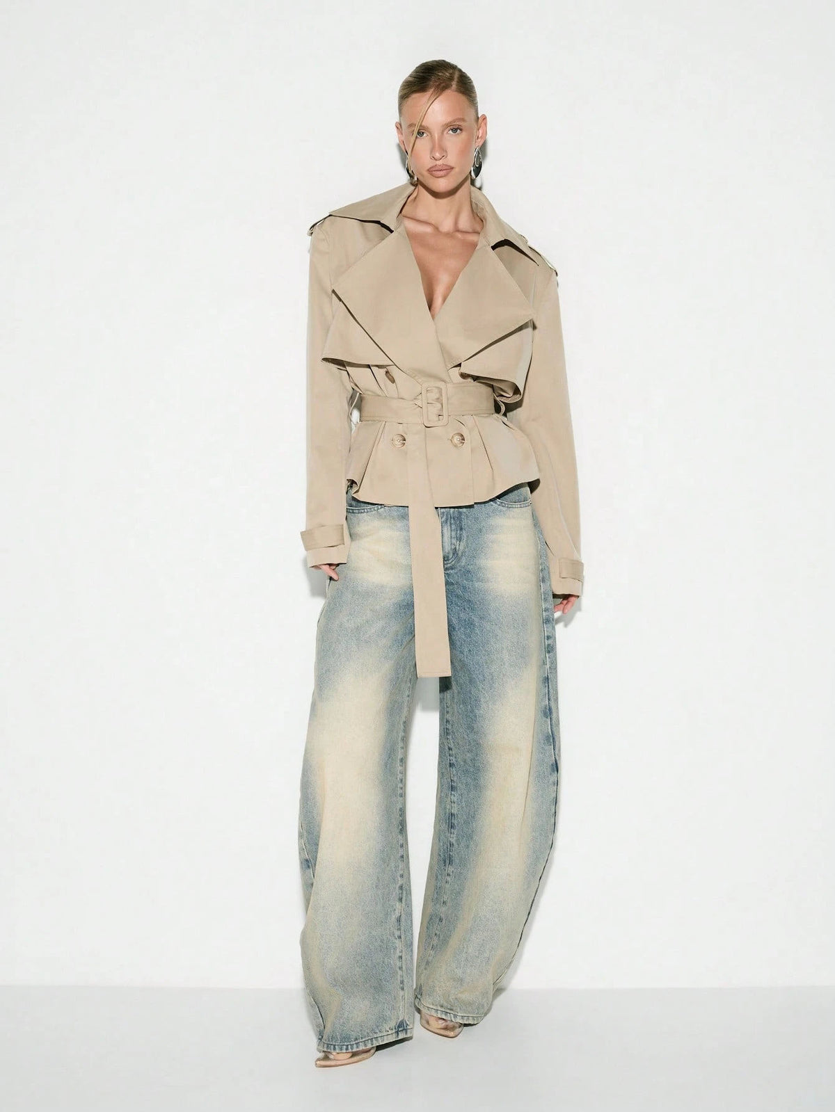 Cropped Double-Breasted Trench Jacket with Belt and Epaulettes in Khaki — full-length view on model with jeans