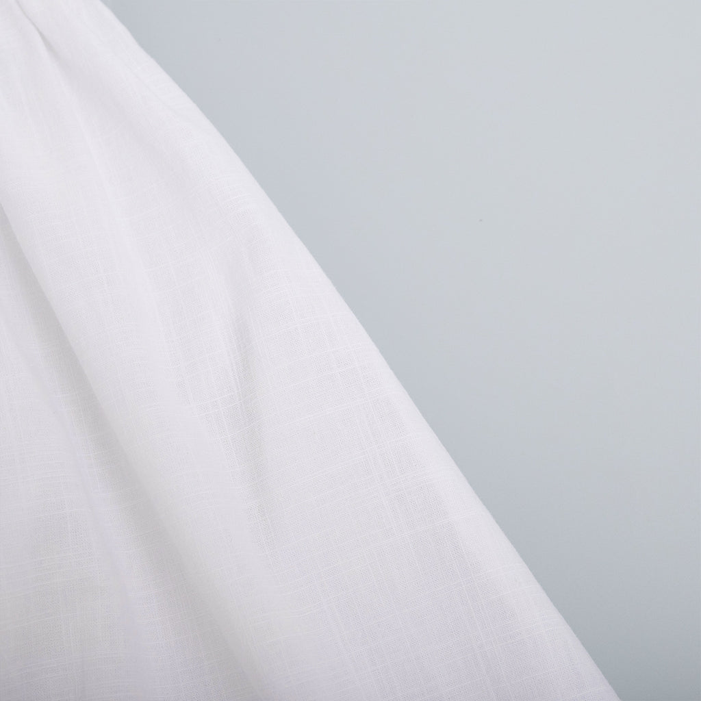 Cotton Halter V-Neck Maxi Dress in White — close-up of the cotton weave