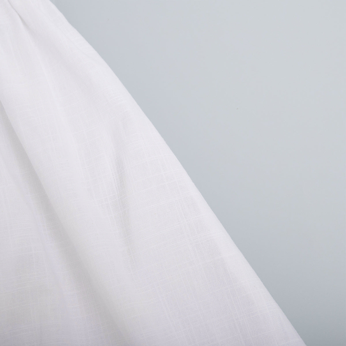 Cotton Halter V-Neck Maxi Dress in White — close-up of the cotton weave