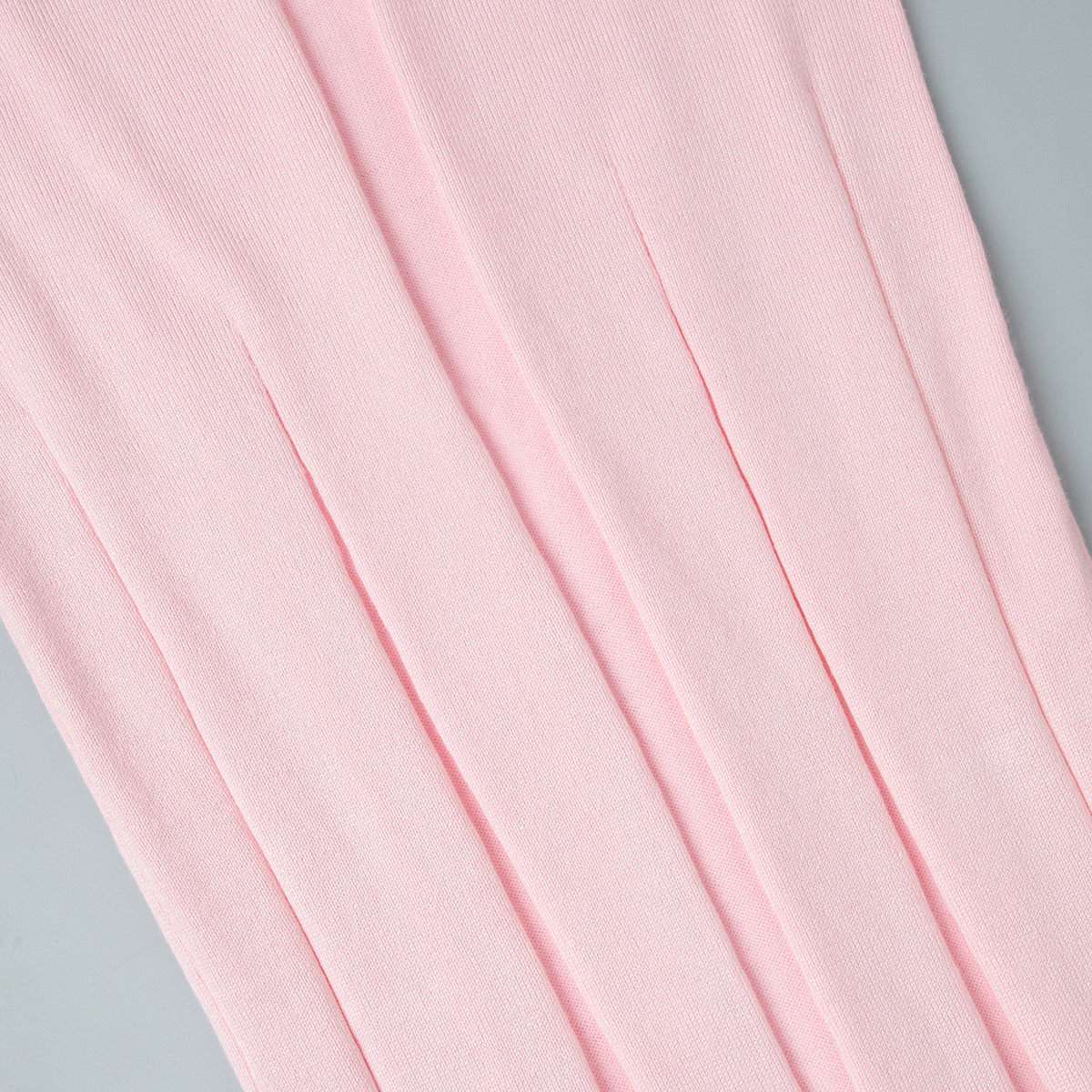Rib-Knit V-Neck Maxi Dress with Side Slit in Soft Pink — close-up of the side slit
