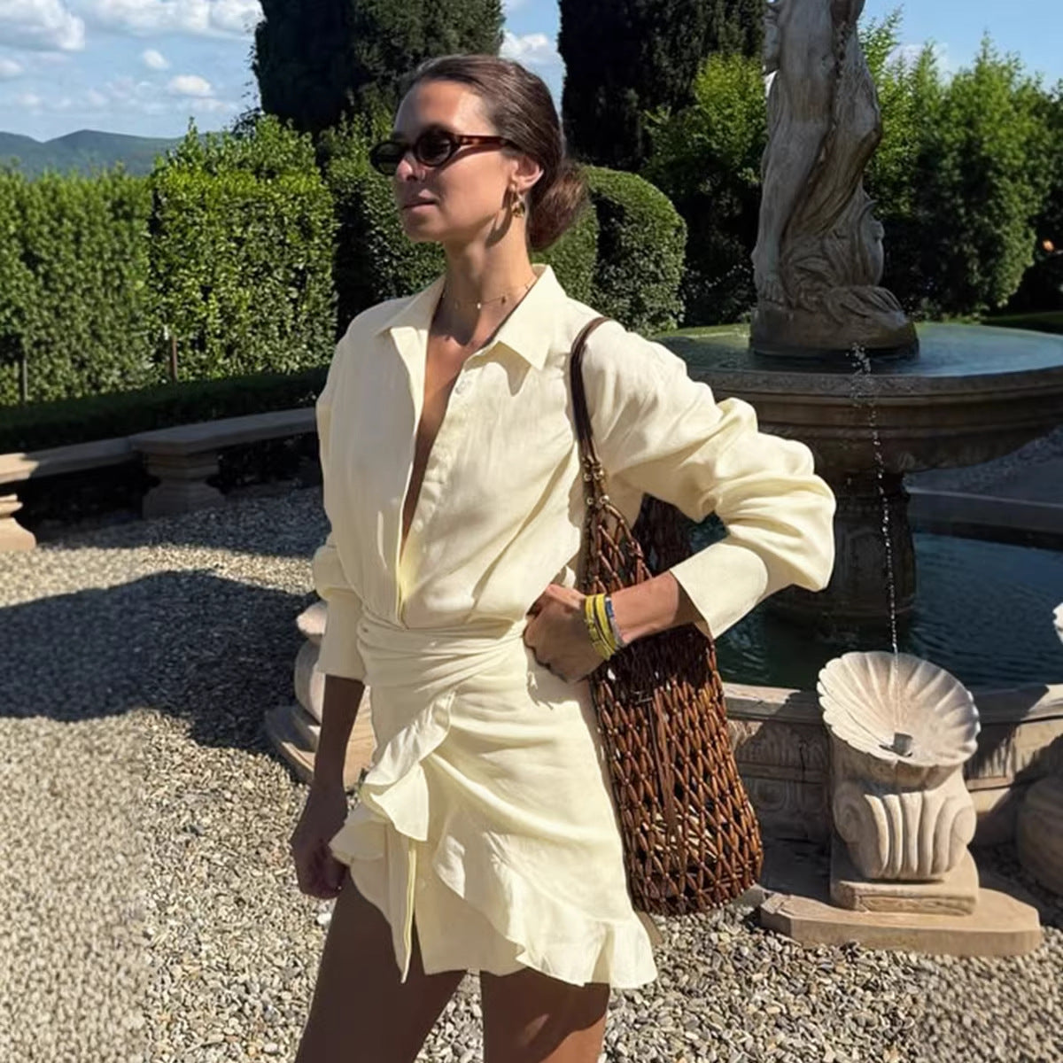 Tie-Front Cotton Mini Shirt Dress in Butter Yellow — front view on model, garden