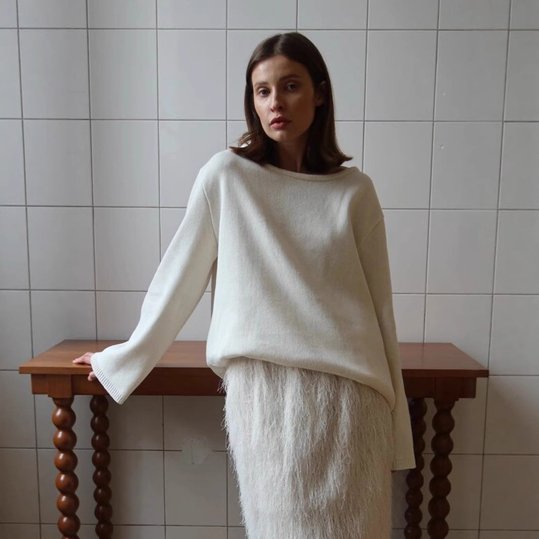 Oversized Open-Back Cotton Knit Sweater in Cream — front view on model with a long skirt