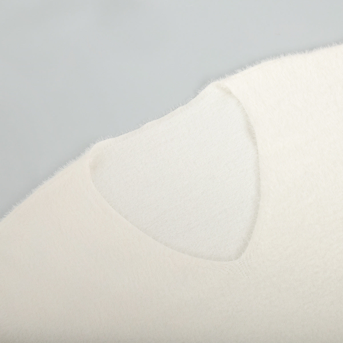 Soft Fuzzy V-Neck Sweater & Knit Maxi Skirt Set in Ivory — close-up of the V-neck