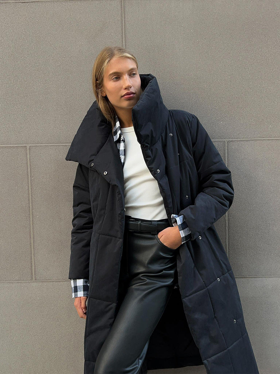 Long Belted Puffer Coat with Oversized Collar in Black — front view on model