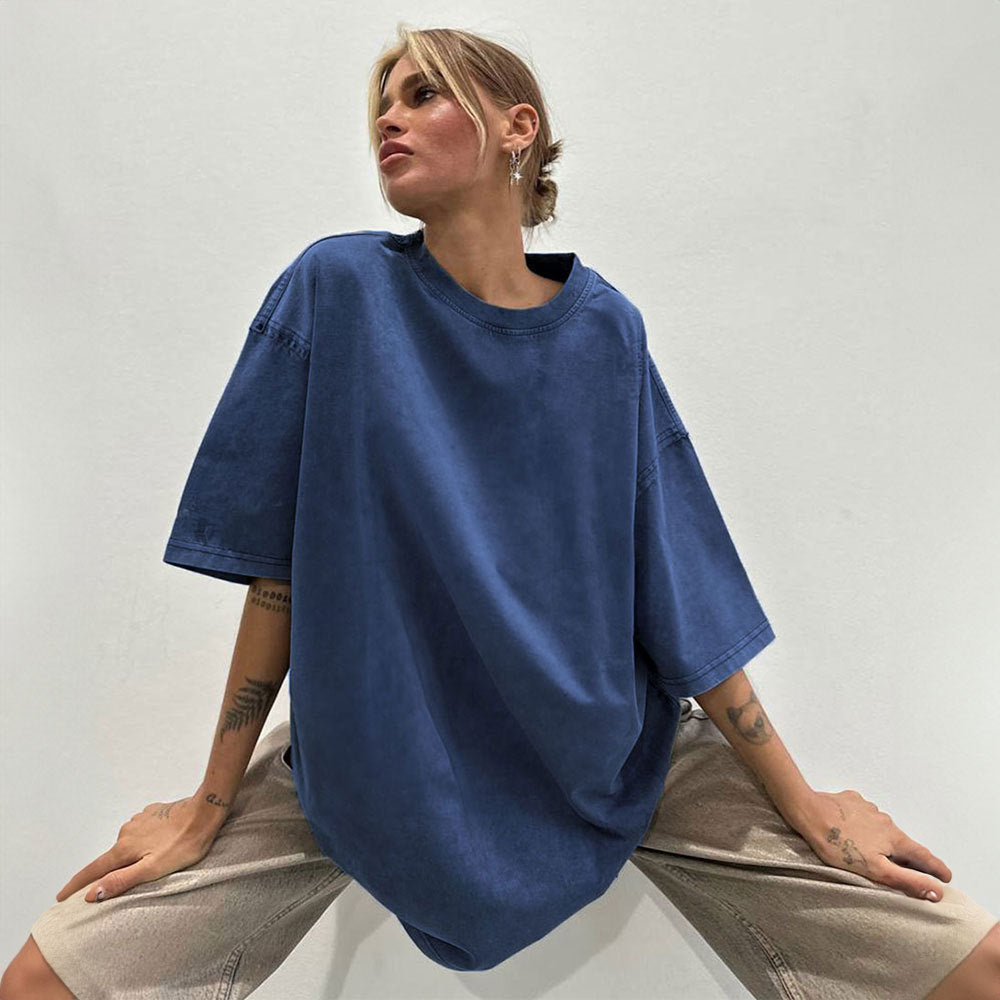 Oversized Washed Cotton Crewneck Tee in Washed Blue — front view on model, seated