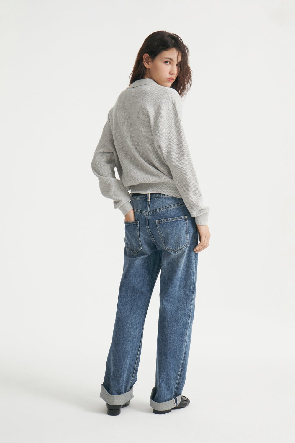 Relaxed Polo Collar Knit Sweater in Light Heather Gray — back view on model
