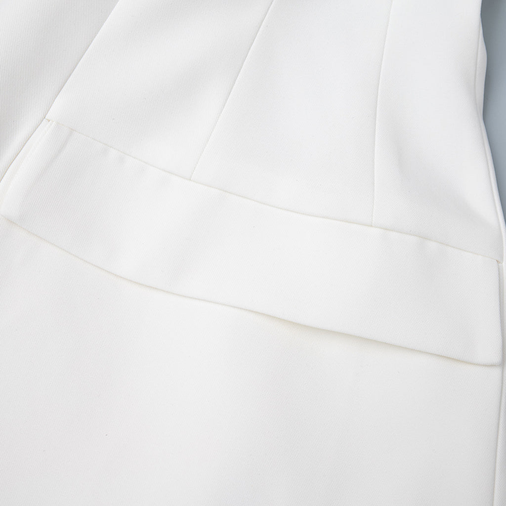 Tailored Two-Button Blazer with Cinched Waist in Ivory — close-up of the flap pocket