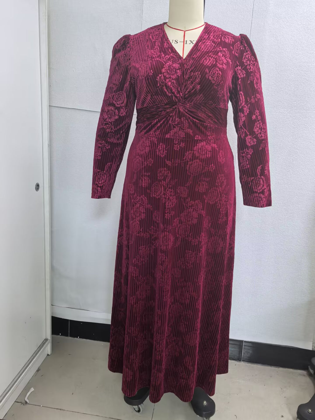 Plus-Size Floral Velvet Maxi Dress with Twist Waist in Wine — front view on mannequin