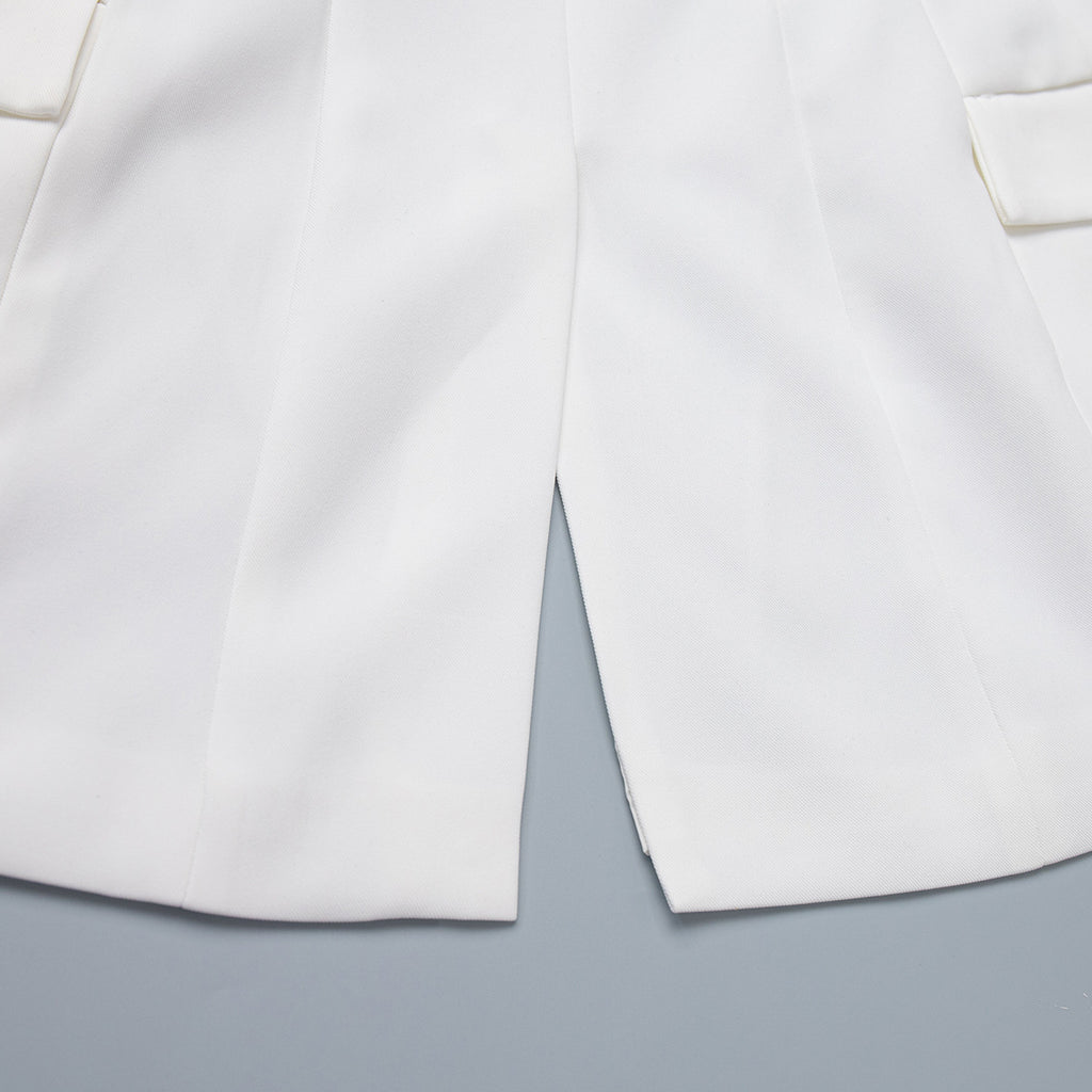 Tailored Two-Button Blazer with Cinched Waist in Ivory — close-up of the back vent
