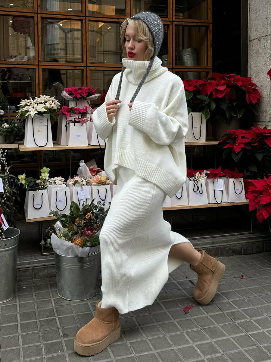 Oversized Turtleneck Sweater & Knit Maxi Skirt Set in Ivory — walking view on model