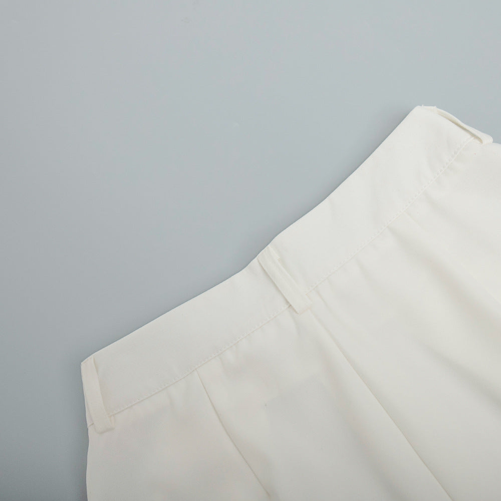 High-Waist Pleated Wide-Leg Trousers in White — close-up of side-seam pocket