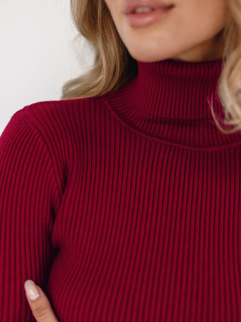 Fitted Ribbed Turtleneck Sweater in Burgundy — close-up of rib knit texture