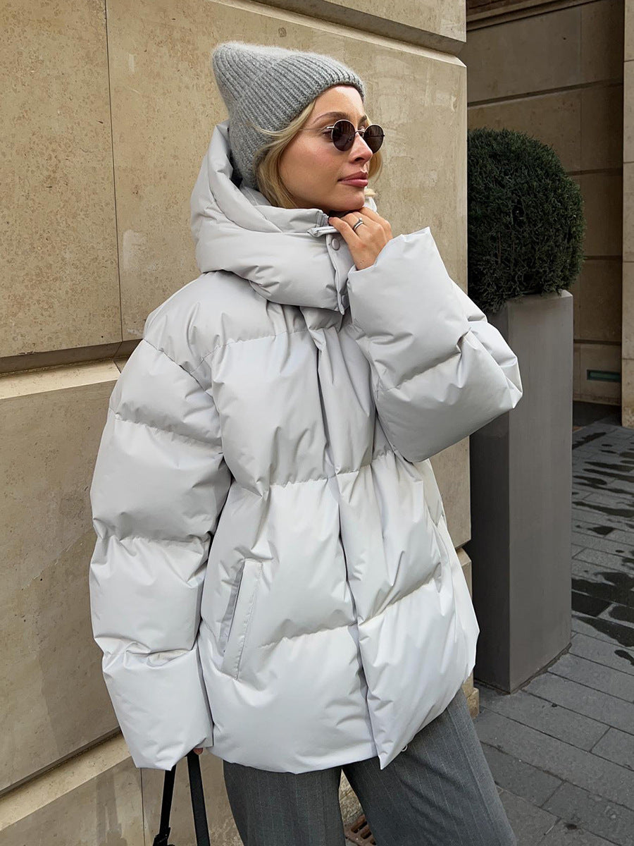 Matte Oversized Hooded Puffer Jacket in Light Gray — on model with the hood